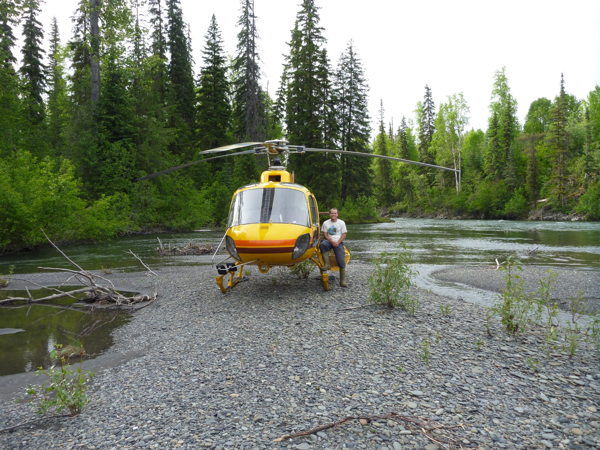 Helicopter and pilot waiting in the forest
