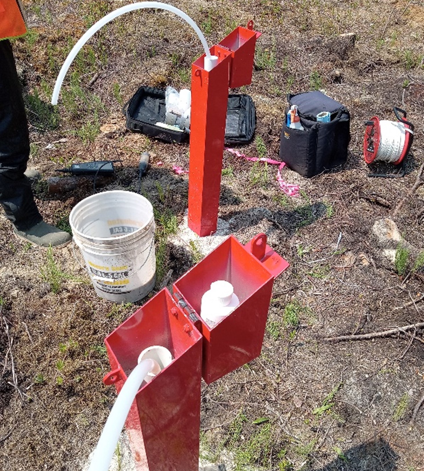 Photo of two groundwater monitoring wells.